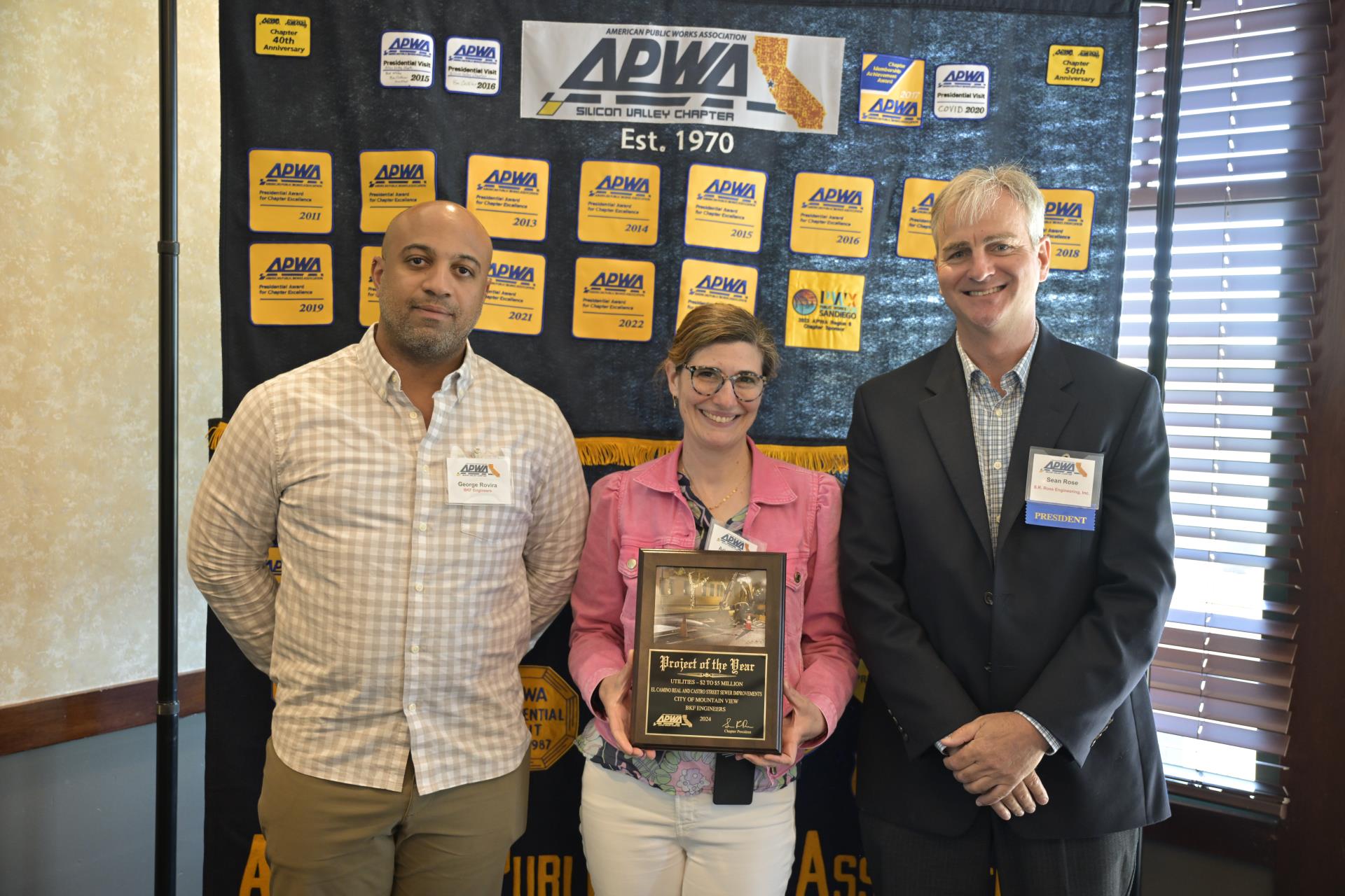 Employee receiving a project of the year award.